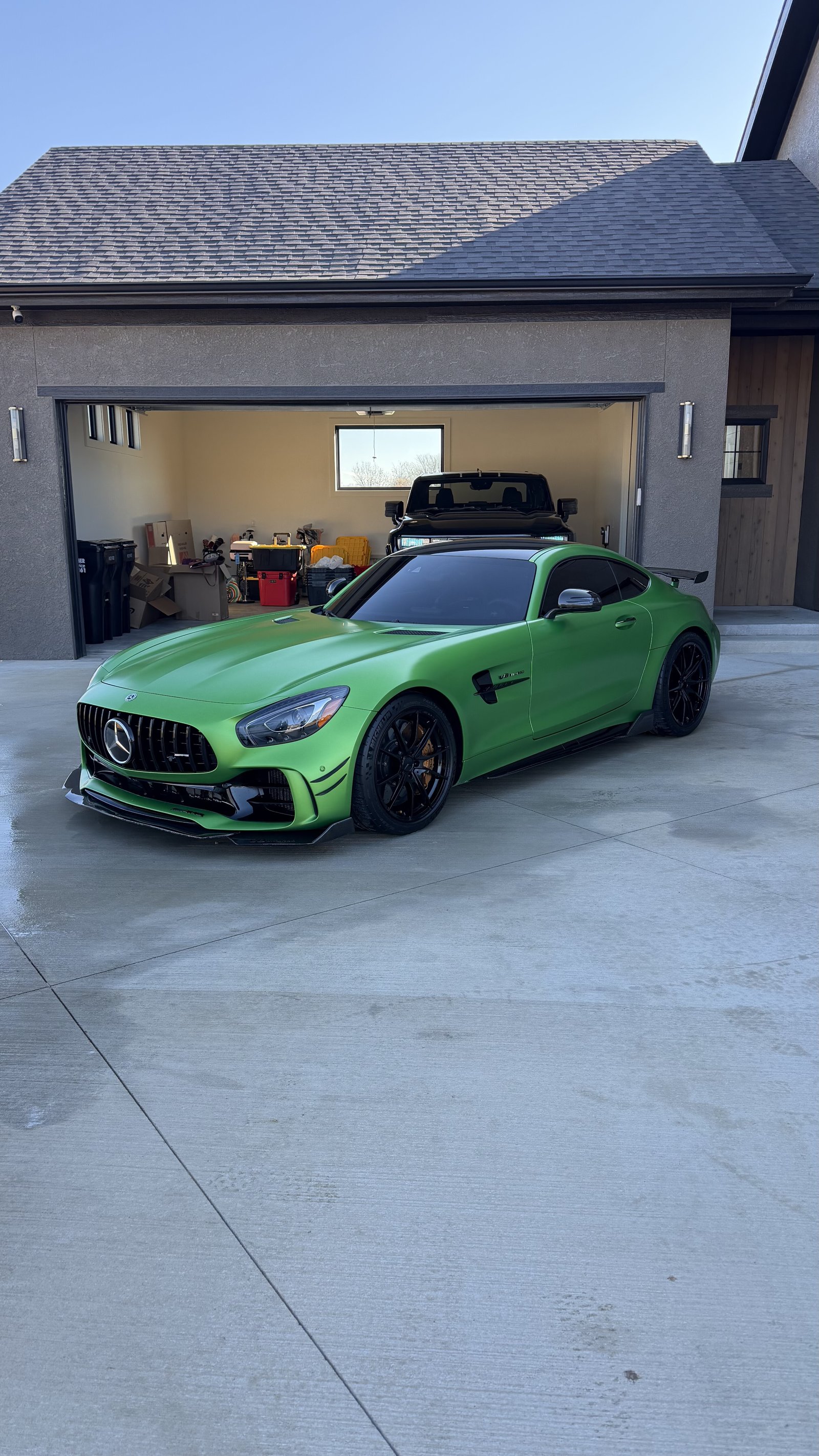 Green Mercedes-AMG GT R with a fresh ceramic coating showing deep gloss