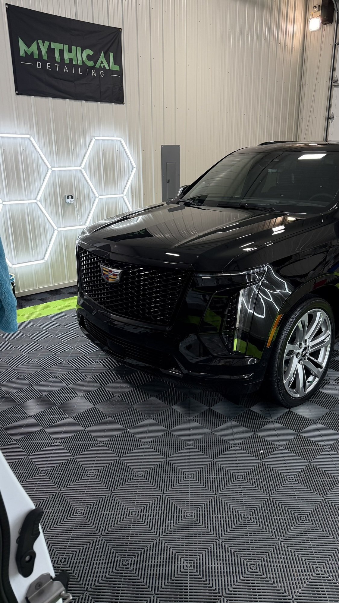Black Cadillac Escalade-V with ceramic coated paint in a Kansas City detailing shop